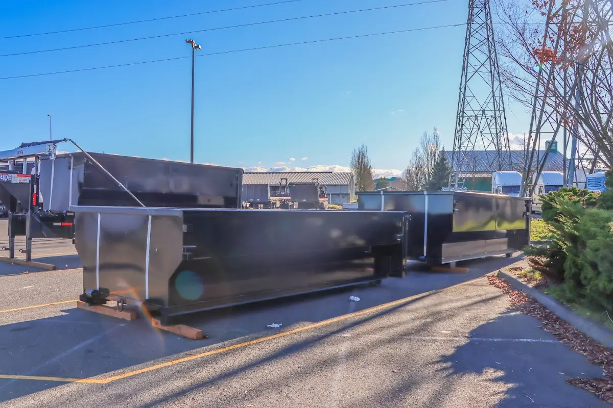 Roll-off dumpster ready for waste disposal at job site for Demolition Dumpster Rental in Kirkwood